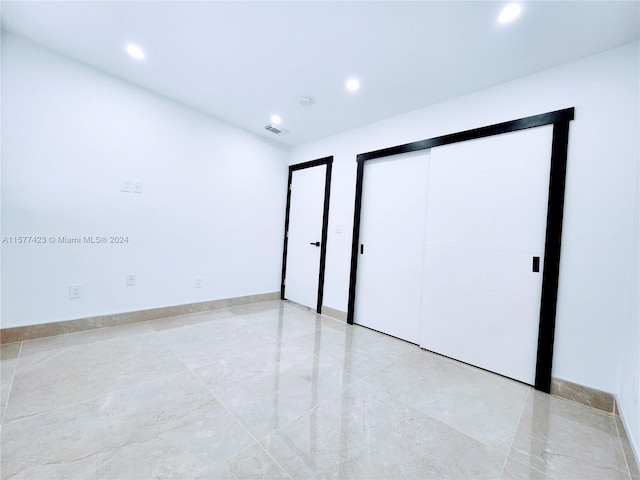 spare room with light tile flooring