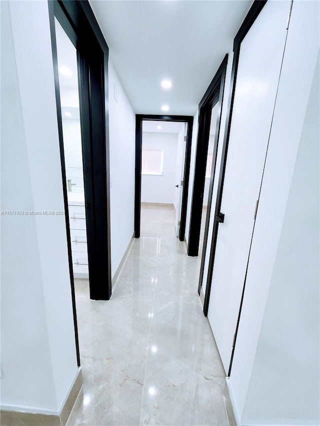 hallway with light tile flooring