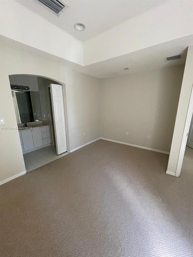 unfurnished living room with carpet flooring