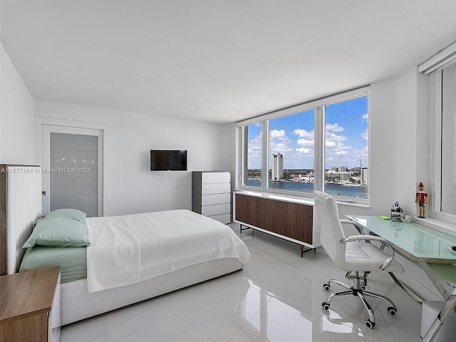 bedroom with light tile patterned flooring