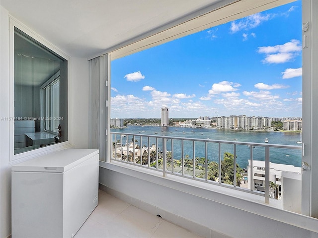 balcony featuring a water view