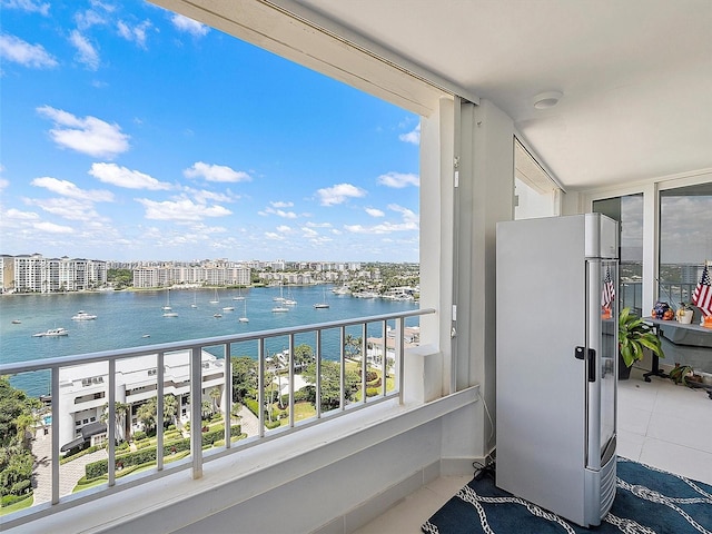 balcony featuring a water view