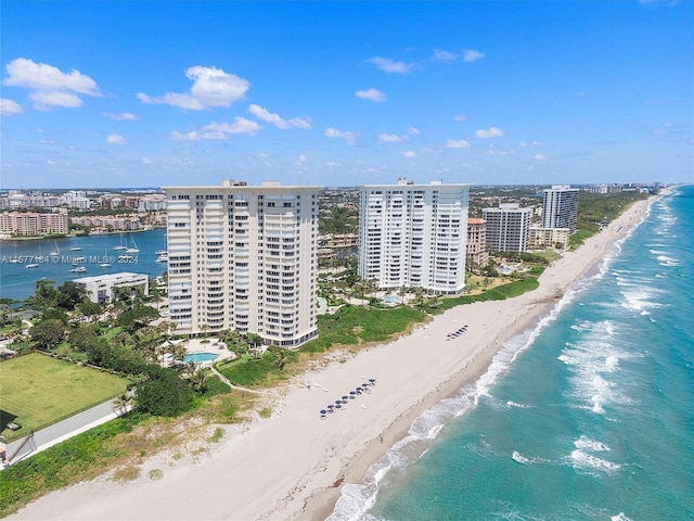 bird's eye view featuring a view of the beach and a water view