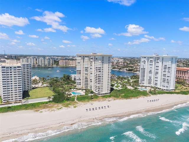 aerial view with a water view and a view of the beach