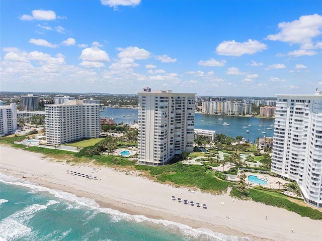 birds eye view of property featuring a view of the beach and a water view