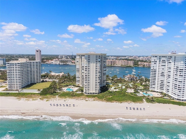 drone / aerial view featuring a view of the beach and a water view