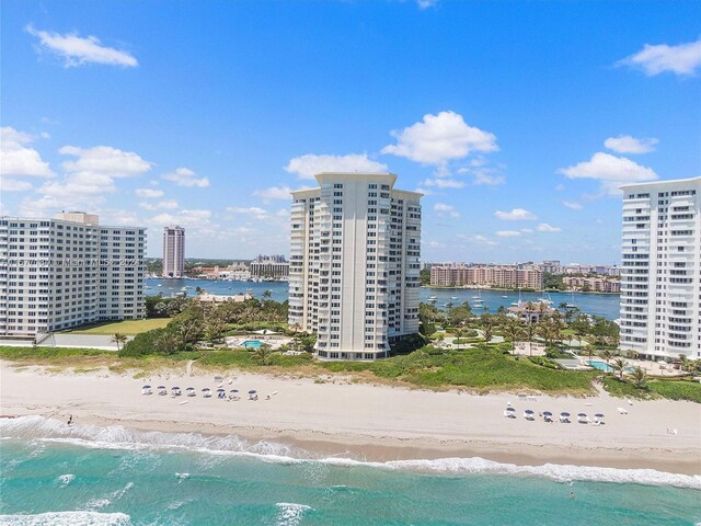 bird's eye view with a view of the beach and a water view