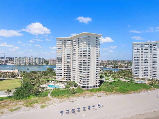 view of property featuring a water view and a view of the beach