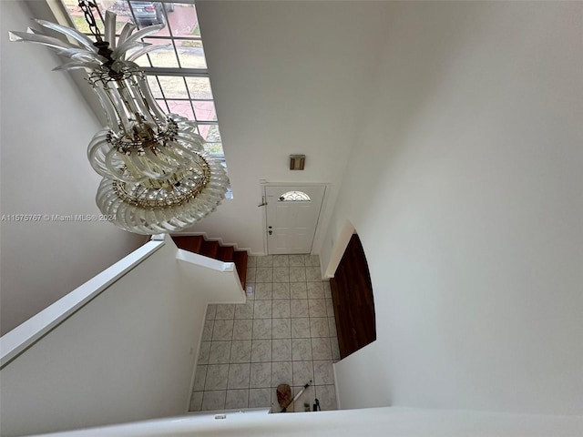 interior space with tile walls and a high ceiling