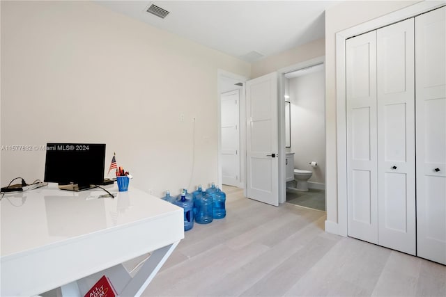 office area with light hardwood / wood-style flooring