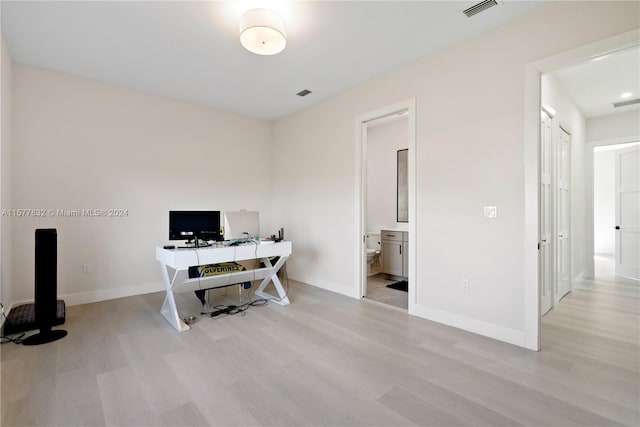 home office featuring light hardwood / wood-style floors