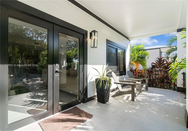 exterior space with french doors and tile flooring