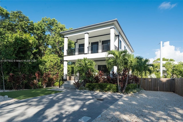 view of front of property with a balcony