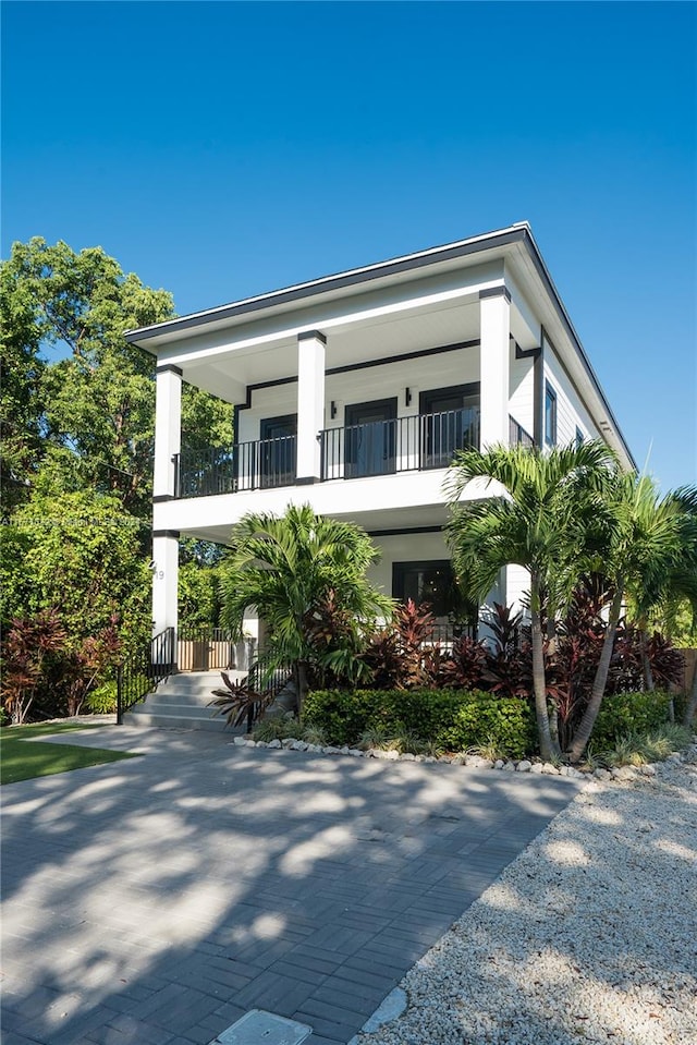 view of front of property with a balcony