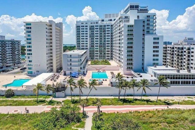 view of building exterior featuring a community pool