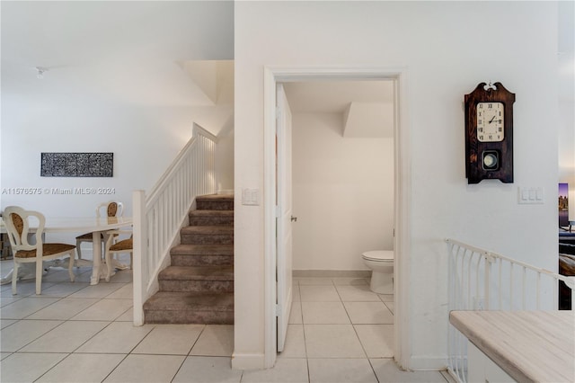 staircase with tile patterned floors