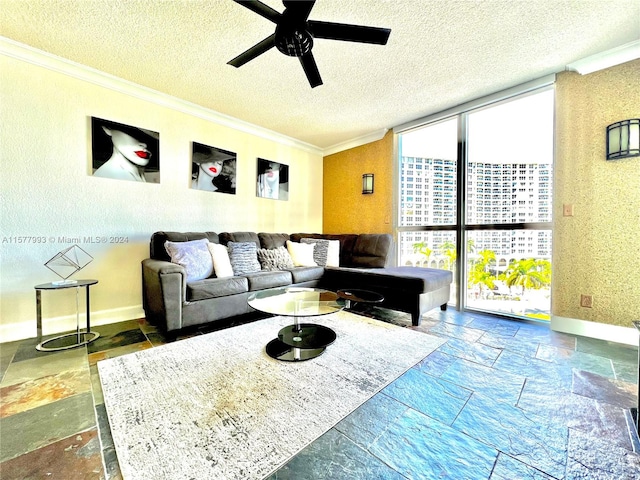 tiled living room featuring a textured ceiling, ceiling fan, crown molding, and expansive windows