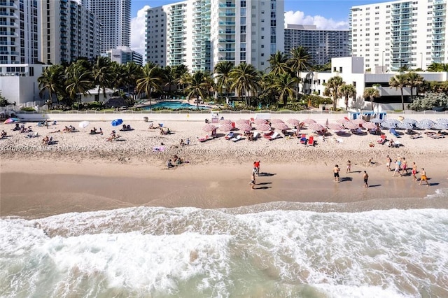 view of home's community featuring a view of the beach