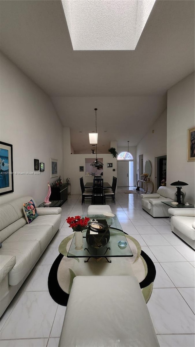 living room with tile flooring and lofted ceiling