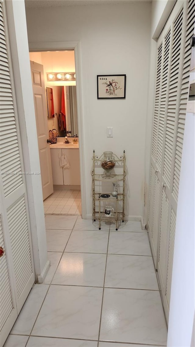 hallway featuring light tile floors