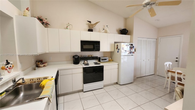 kitchen featuring white appliances, sink, light tile floors, and white cabinetry