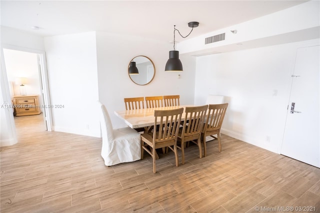 dining area with light hardwood / wood-style flooring