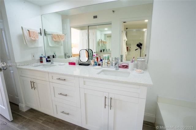 bathroom featuring double vanity