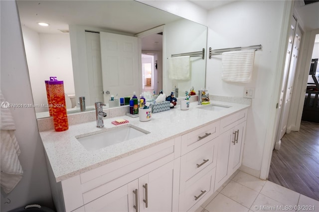 bathroom featuring vanity and tile flooring