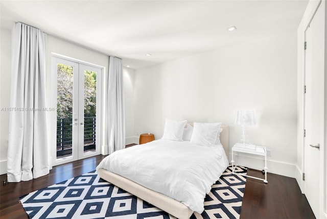 bedroom with french doors, dark hardwood / wood-style floors, and access to exterior