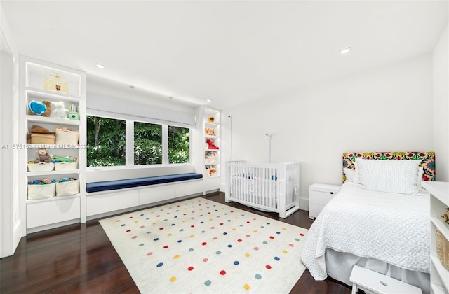 bedroom featuring dark hardwood / wood-style floors