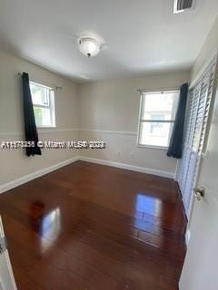 unfurnished room featuring hardwood / wood-style floors