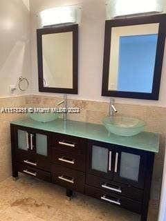 bathroom featuring double sink vanity