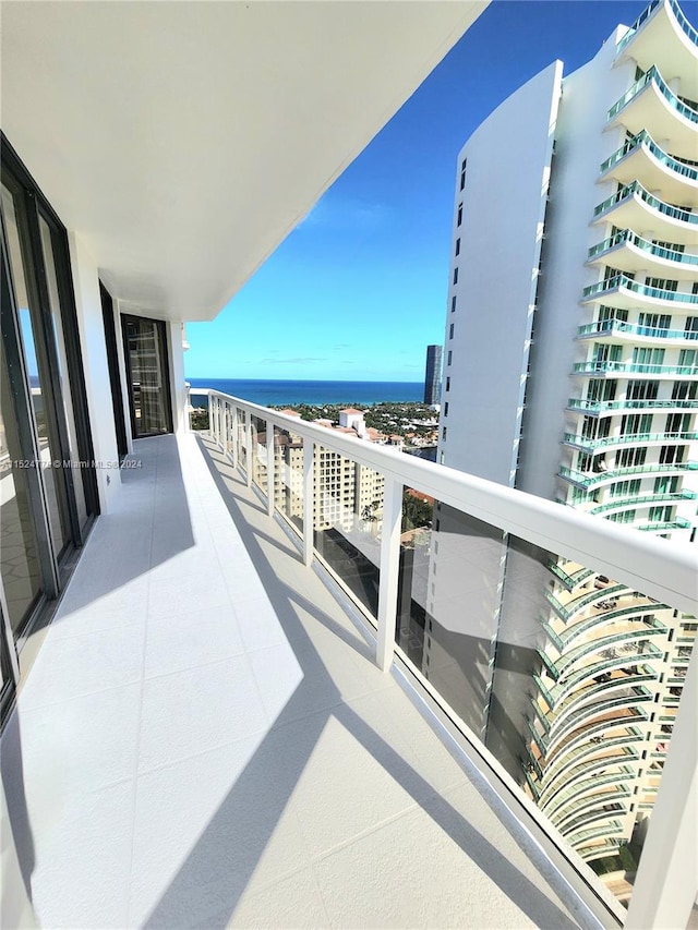 balcony featuring a water view