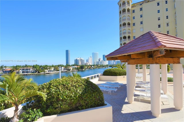 exterior space with a water view and a gazebo