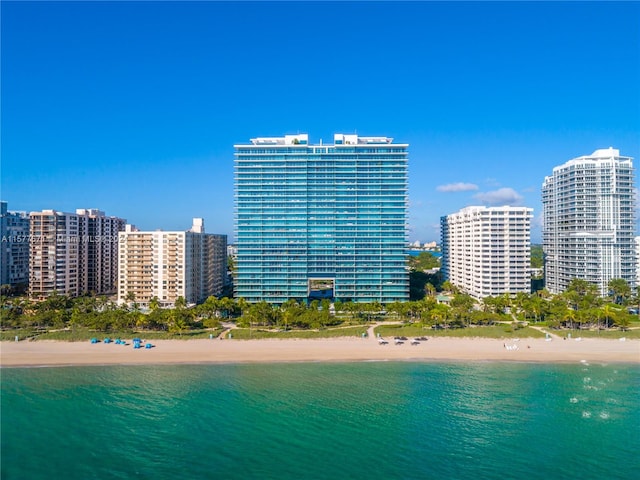 aerial view featuring a water view and a beach view