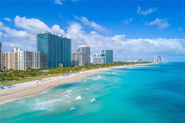 bird's eye view with a beach view and a water view