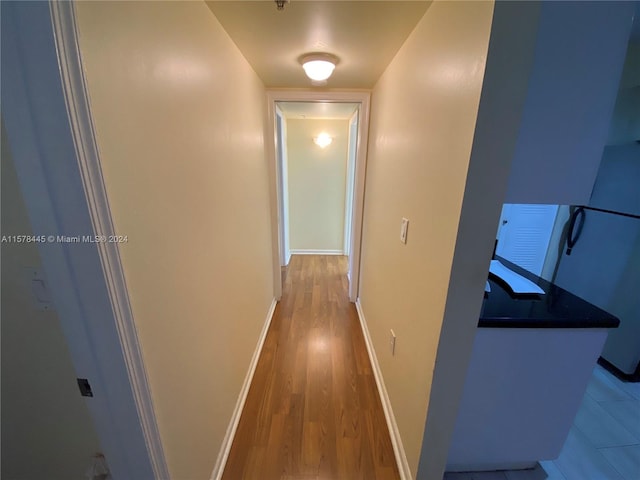 hallway featuring hardwood / wood-style flooring