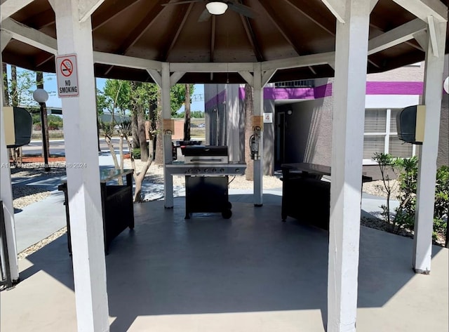 view of terrace featuring ceiling fan and a gazebo