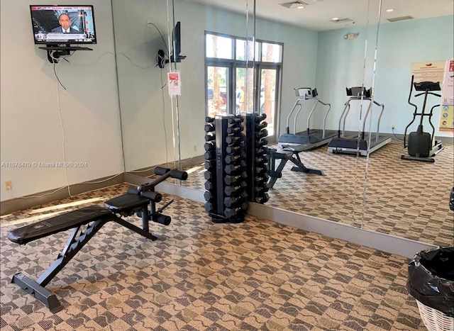 exercise room featuring carpet flooring