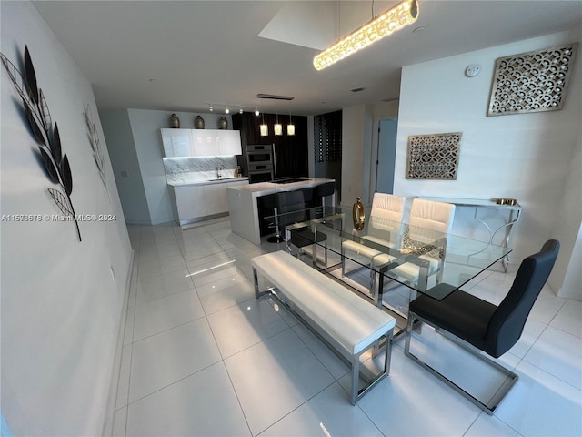 tiled dining room with sink