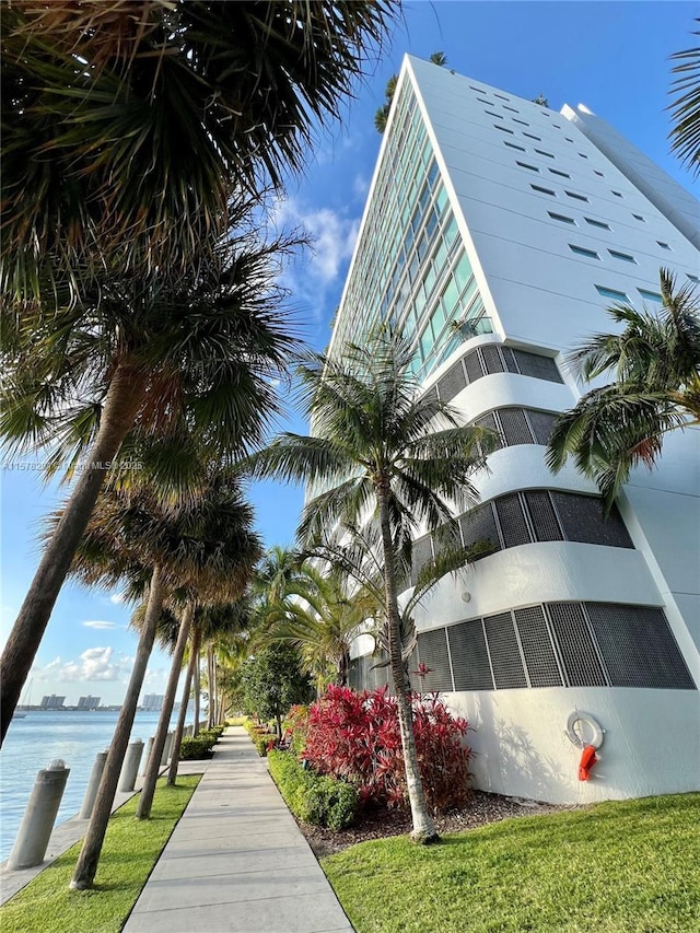 view of building exterior with a water view