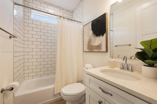 full bathroom featuring shower / bath combo, toilet, and vanity with extensive cabinet space