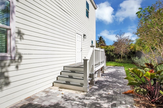 view of side of property featuring a patio