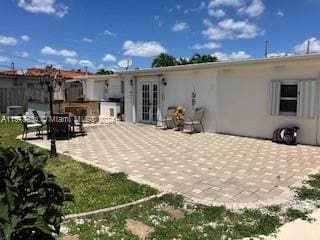 back of property with a patio area