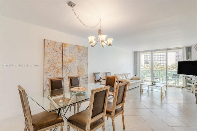 tiled dining space with floor to ceiling windows and an inviting chandelier