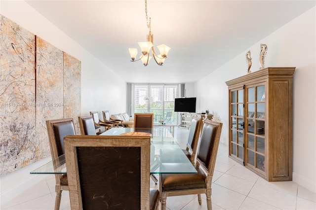 tiled dining room with a notable chandelier and expansive windows