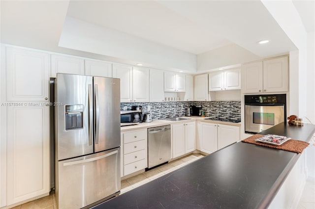 kitchen with white cabinetry, light tile patterned floors, and appliances with stainless steel finishes