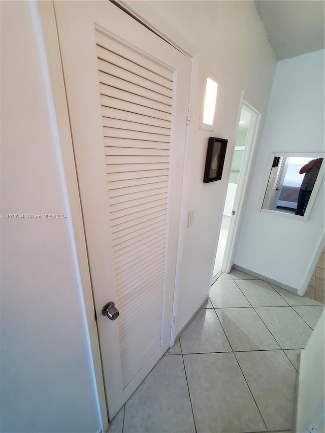 corridor featuring light tile patterned flooring