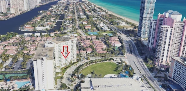 drone / aerial view featuring a water view and a beach view