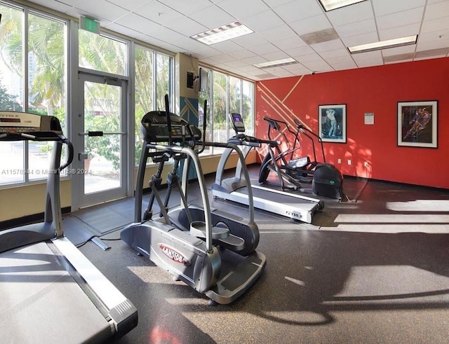 exercise room featuring a paneled ceiling